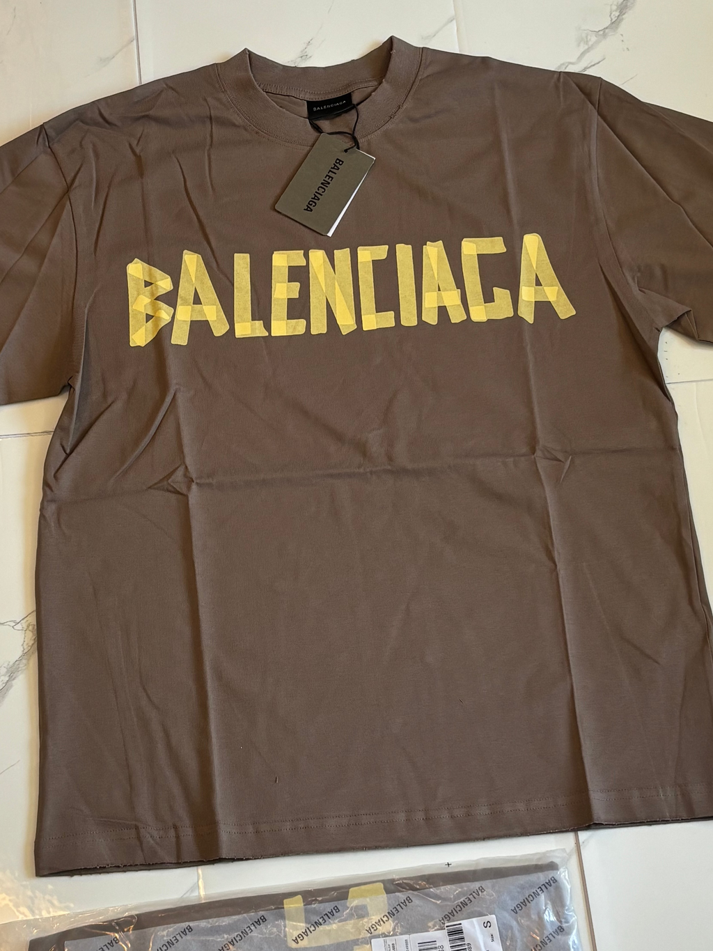 BALNCIAGA YELLOW TAPE tan t shirt