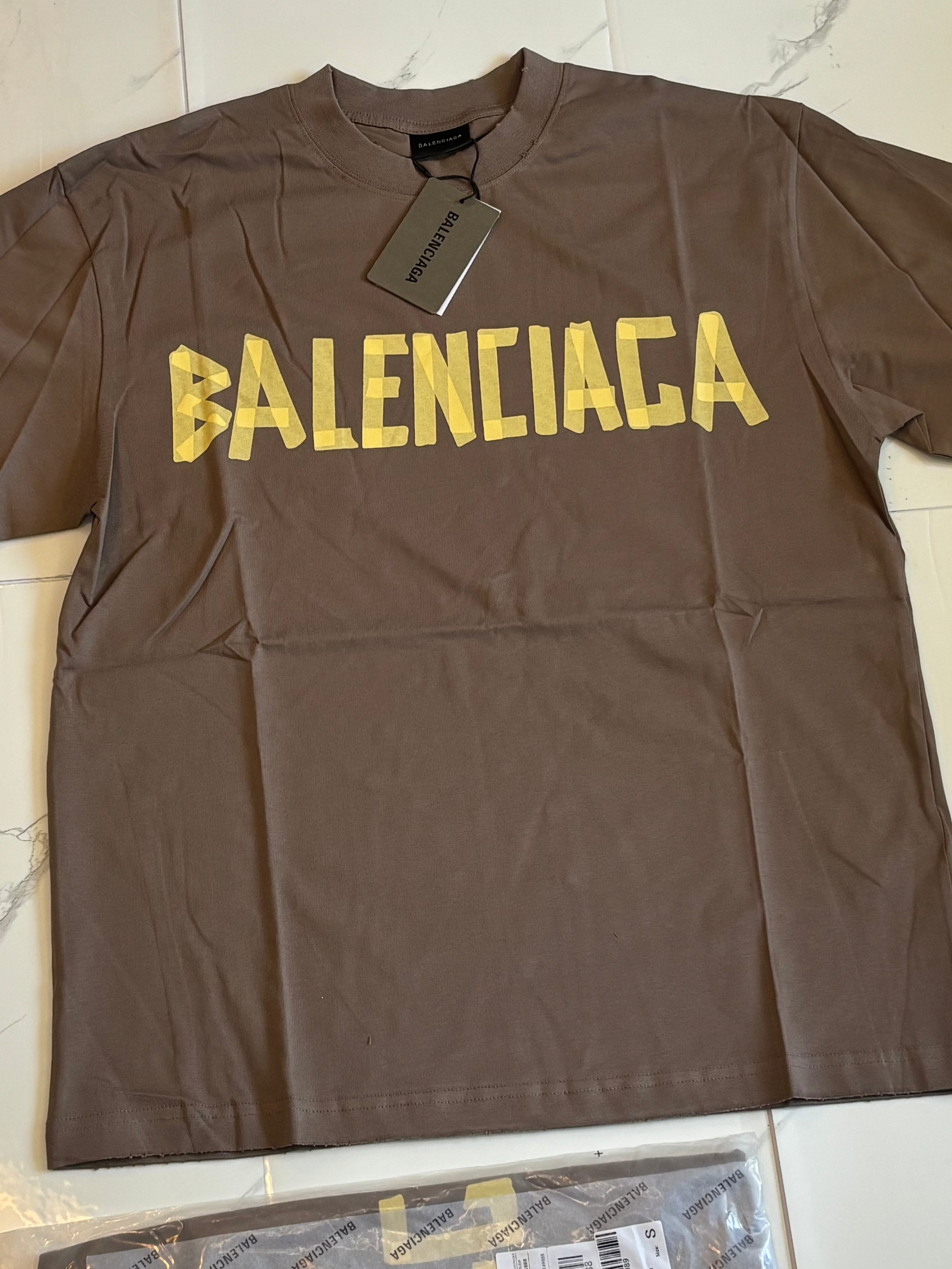 BALNCIAGA YELLOW TAPE tan t shirt