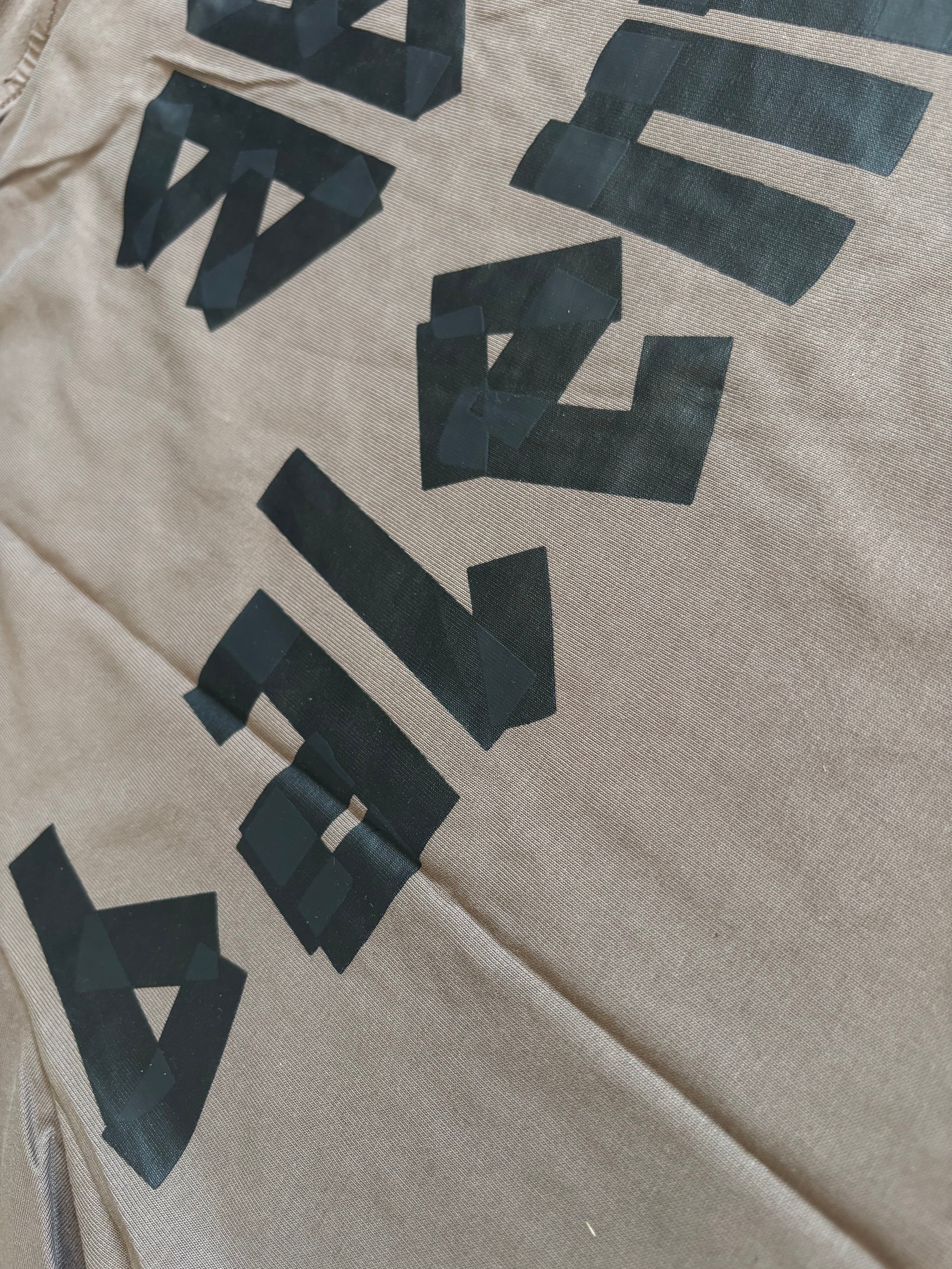 BALNCIAGA YELLOW TAPE tan t shirt
